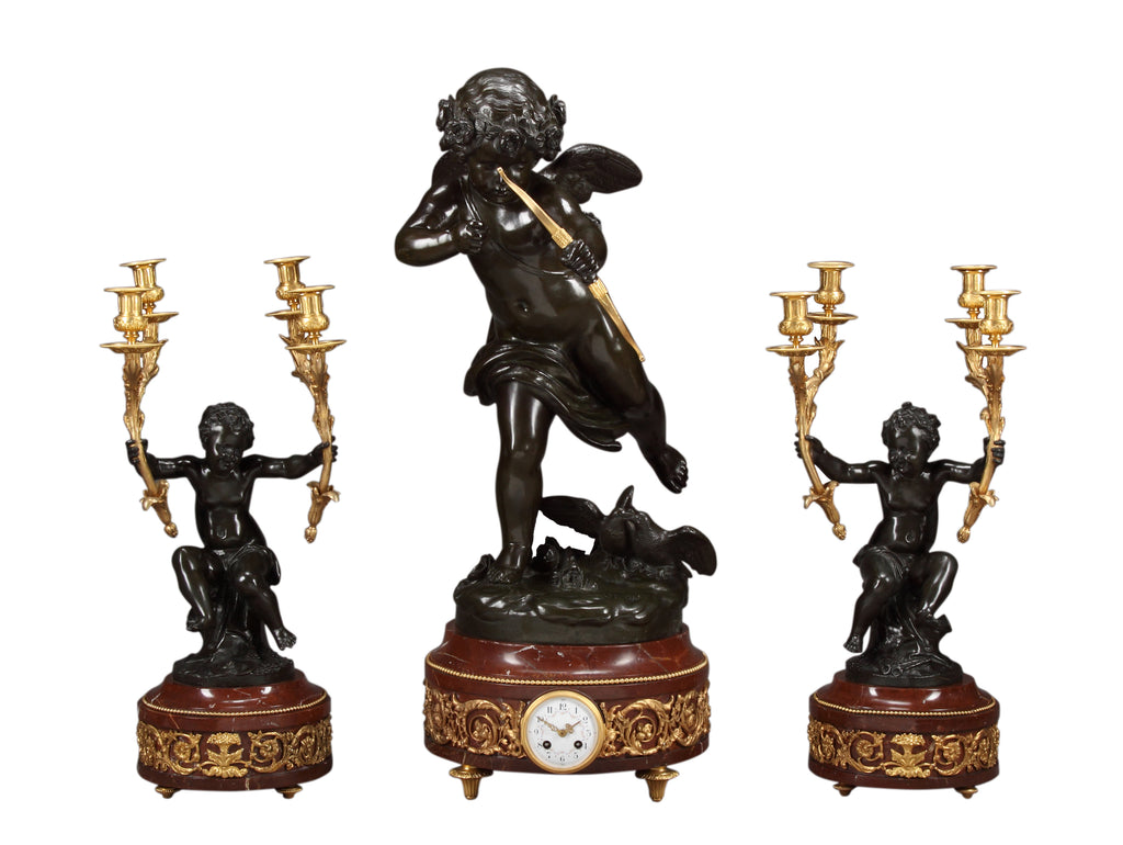 A LARGE FRENCH PATINATED BRONZE FIGURAL CLOCK GARNITURE AFTER JEAN ANTOINE HOUDON